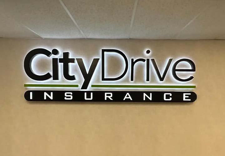 City Drive Insurance light box displaying the company name for interior branding