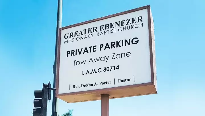 Pylon sign for Greater Ebenezer Missionary Baptist Church featuring texts in black letters