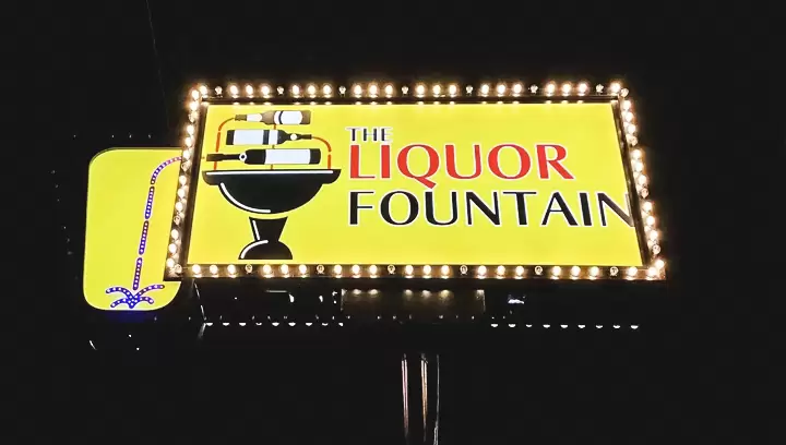 Outdoor pylon sign designed in a retro style made for The Liquor Fountain