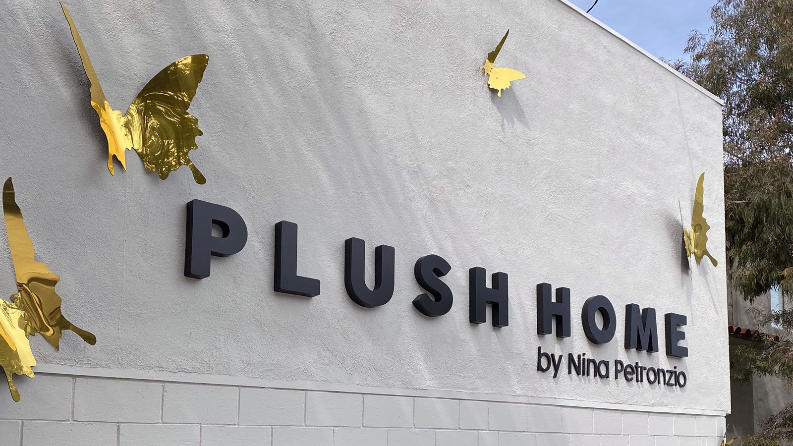 Plush Home custom 3d sign with golden decorative butterflies made of aluminum for branding