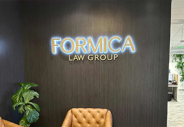 Formica Law Group backlit channel letters spelling out the brand name on the wall