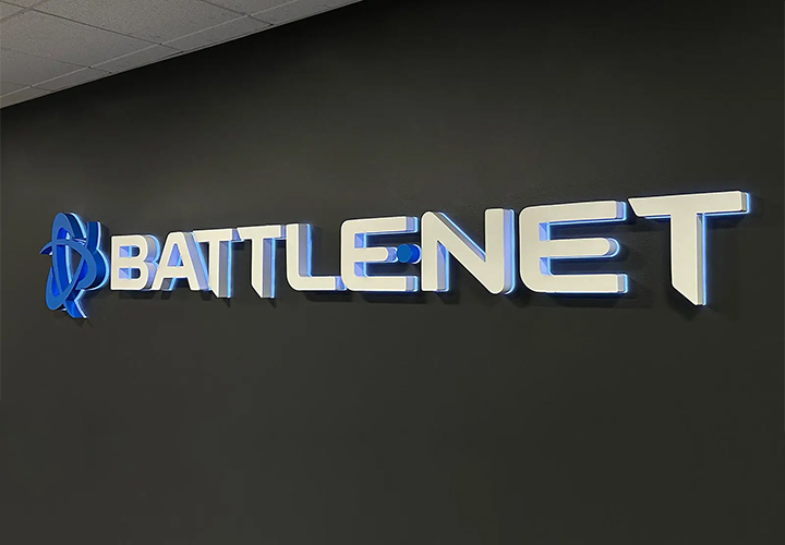 Battlenet halo-lit sign mounted on the wall and displaying the brand name