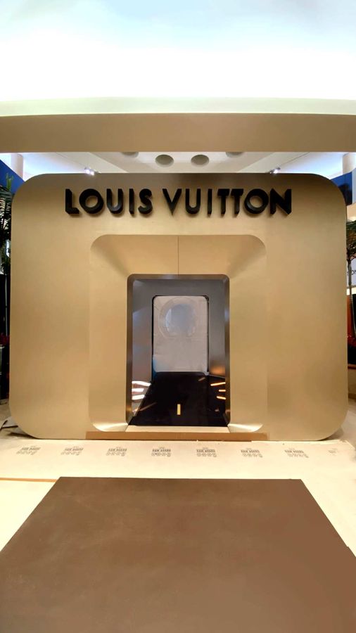 Louis Vuitton light up sign installed indoors