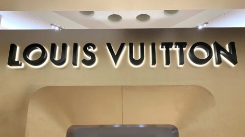 Louis Vuitton Logo on Signboard on Store Front in the Street