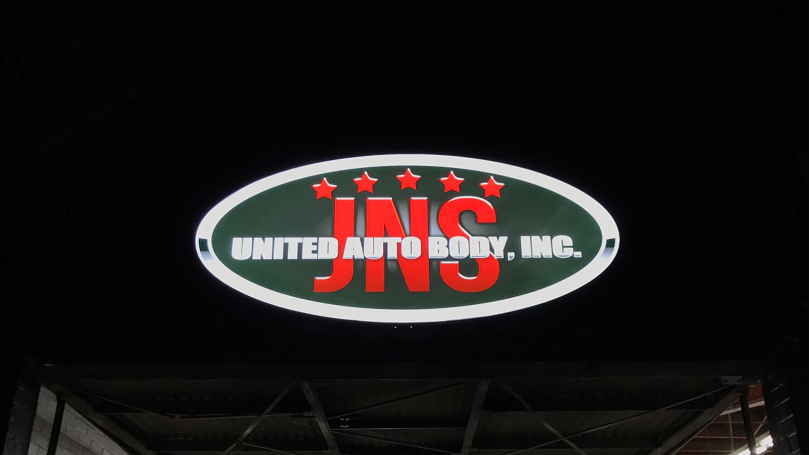 jns illuminated lightbox sign at night