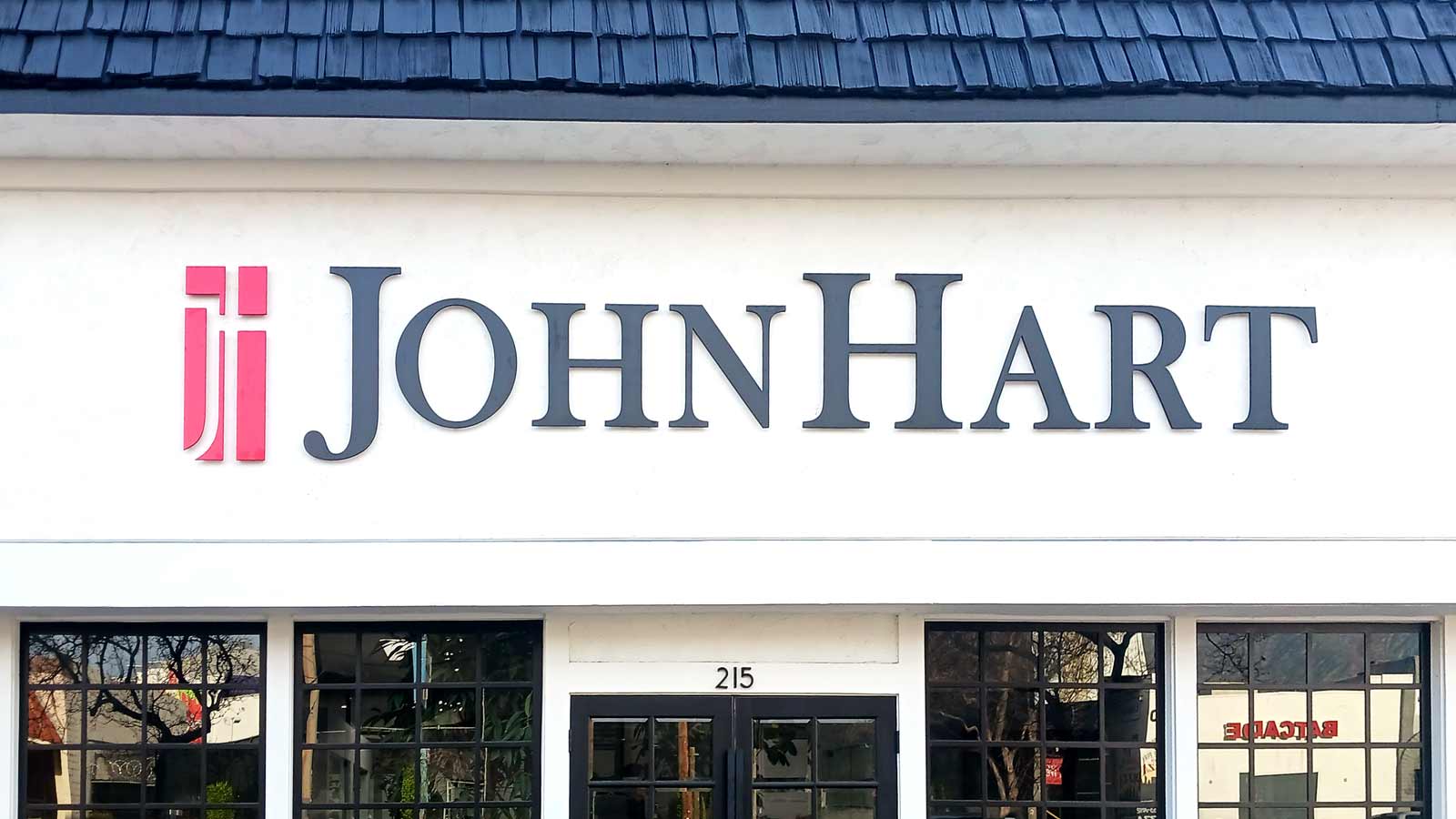 john hart realty logo sign installed outdoors
