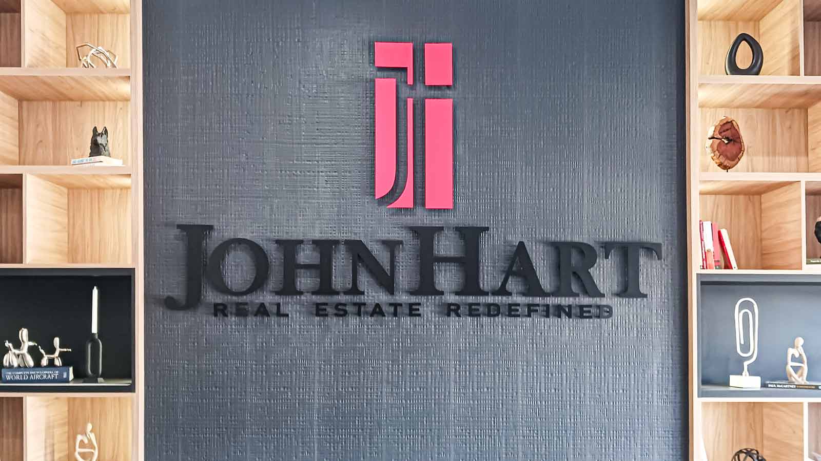 john hart realty office sign installed indoors
