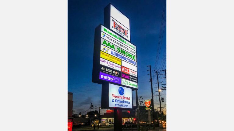 Large illuminated Pylon Sign with various advertisements | Front Signs