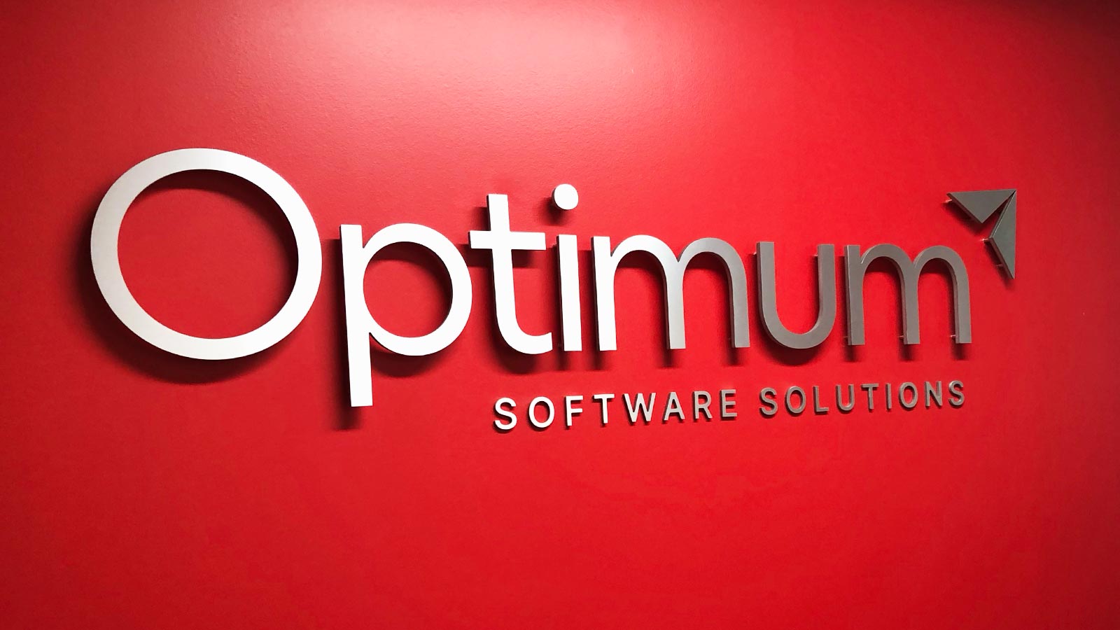 optimum consultancy services wall sign installed indoors