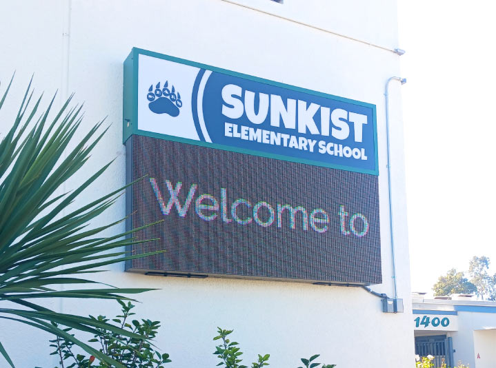 Sunkist Elementary School LED display with a printed metal sheet installed outdoors