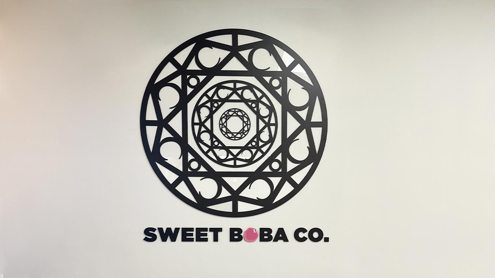 sweet boba co restaurant sign installed indoors