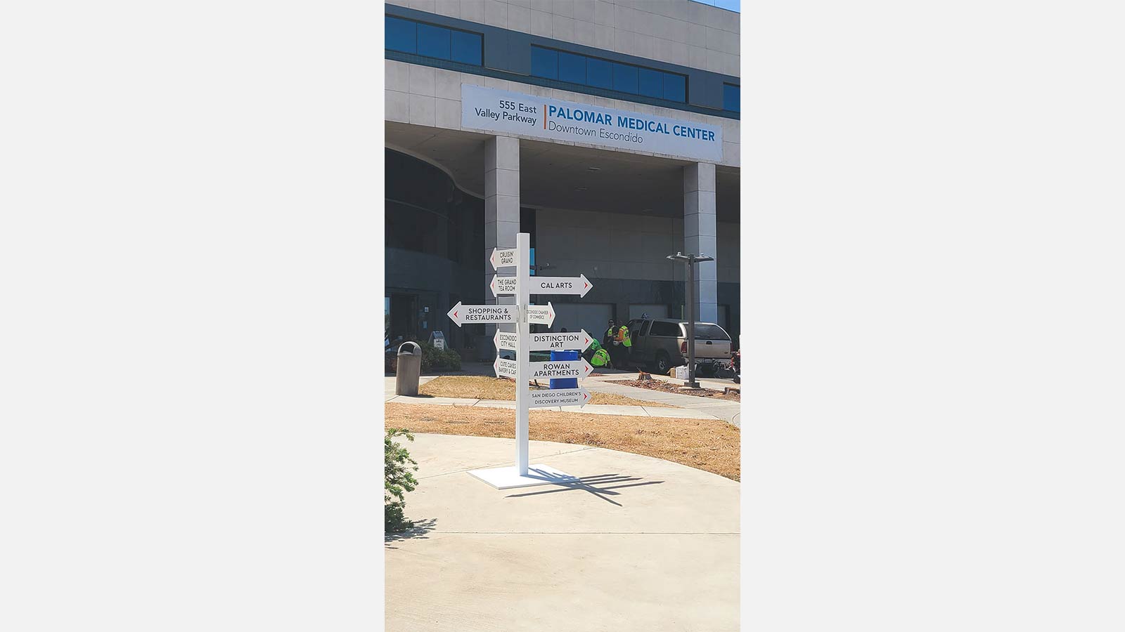 white free standing directional sign
