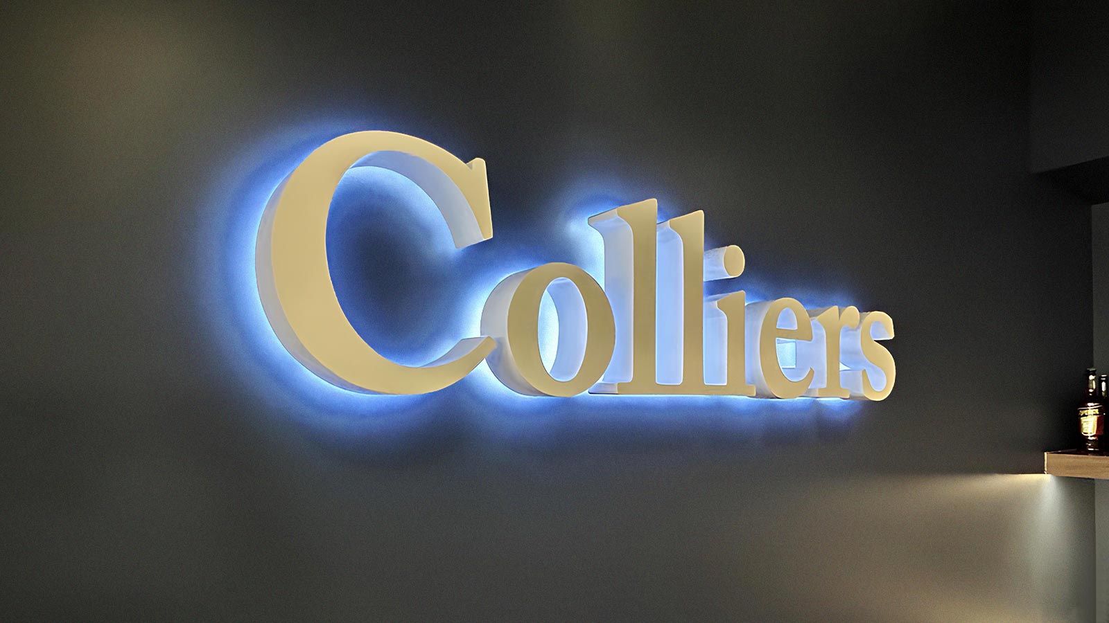 colliers interior reverse channel letters attached to a wall