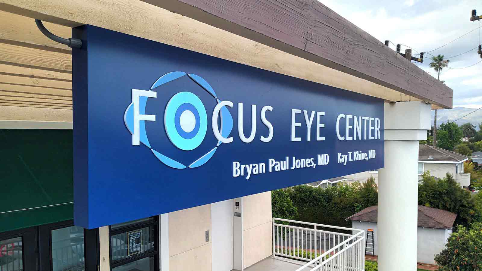 focus eye center push through sign