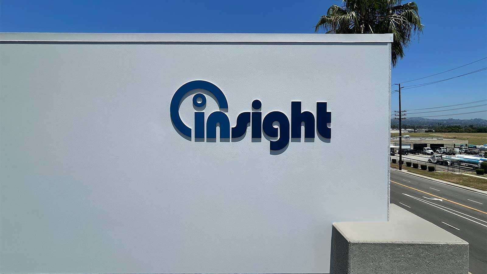 insight logistics inc high rise sign attached to a building