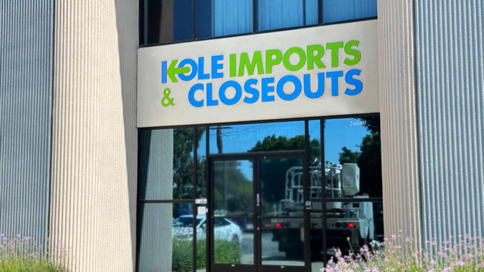 kole imports and closeouts building sign set up on a facade