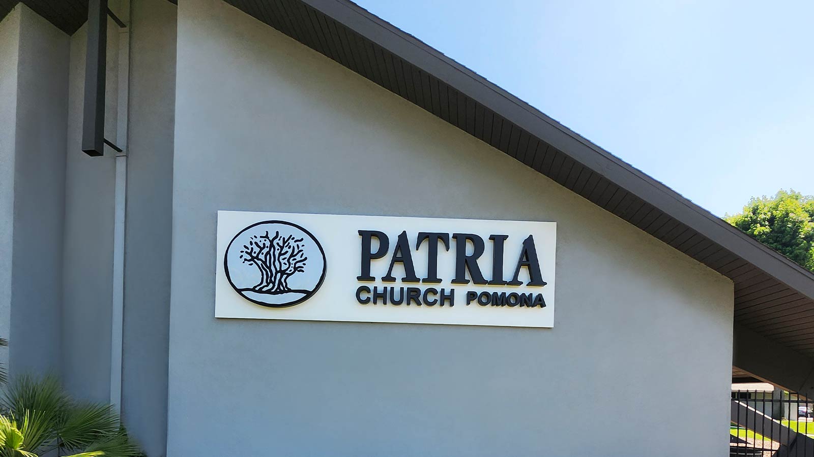 patria custom signage attached to the outdoor wall