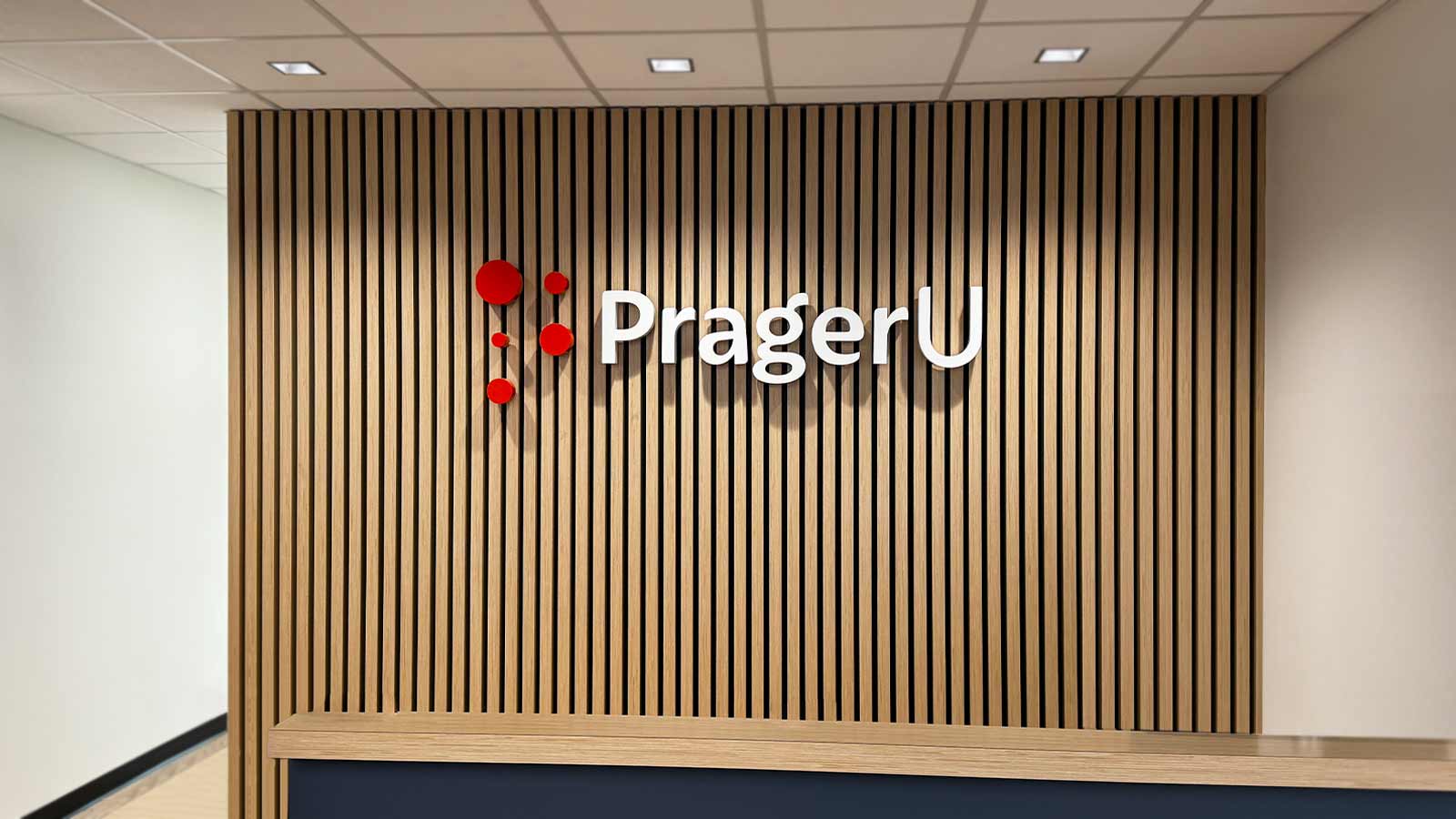 prageru lobby sign on the interior wall