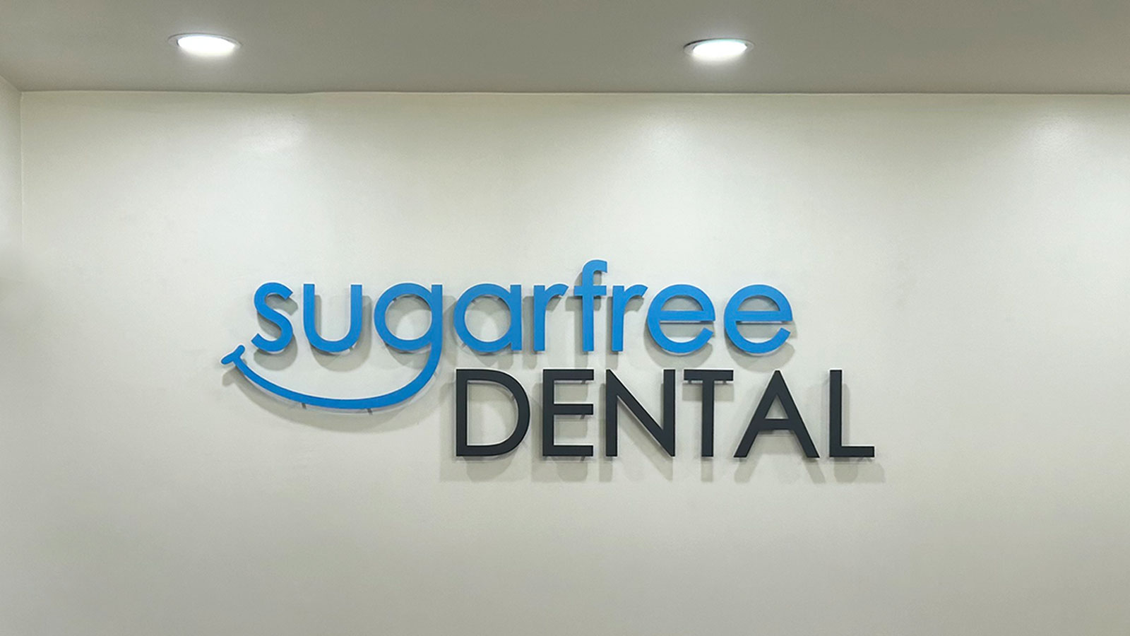 sugarfree dental wall sign mounted indoors