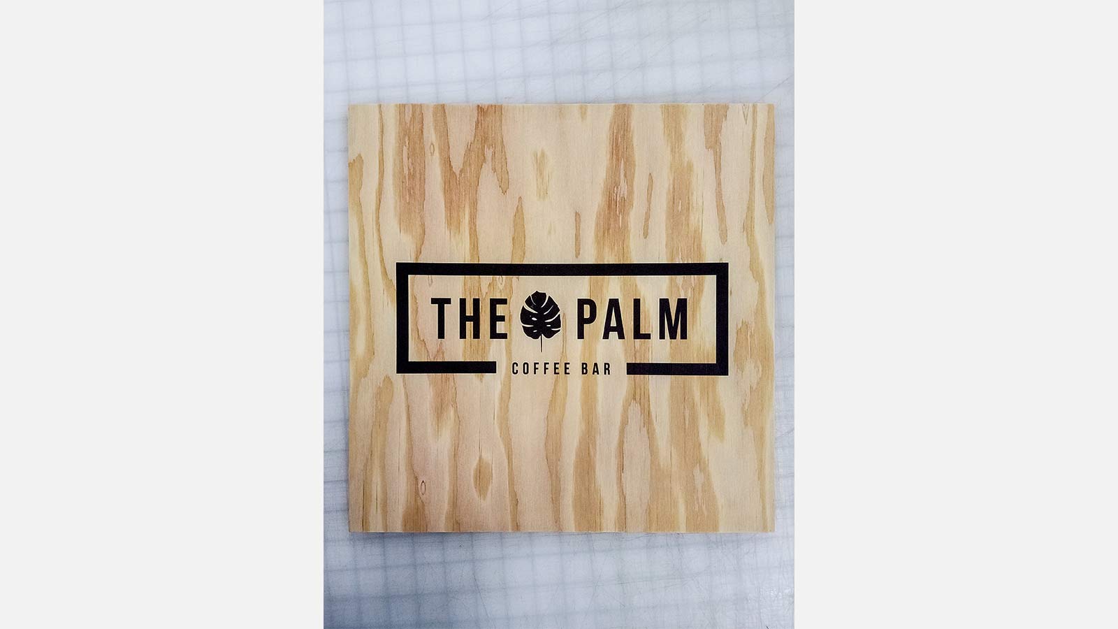 Printed wooden signage for The Palm coffee bar