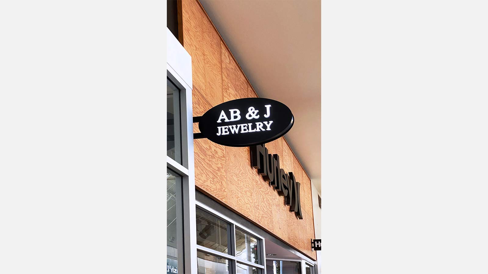 AB & J Jewelry wall-blade light box sign