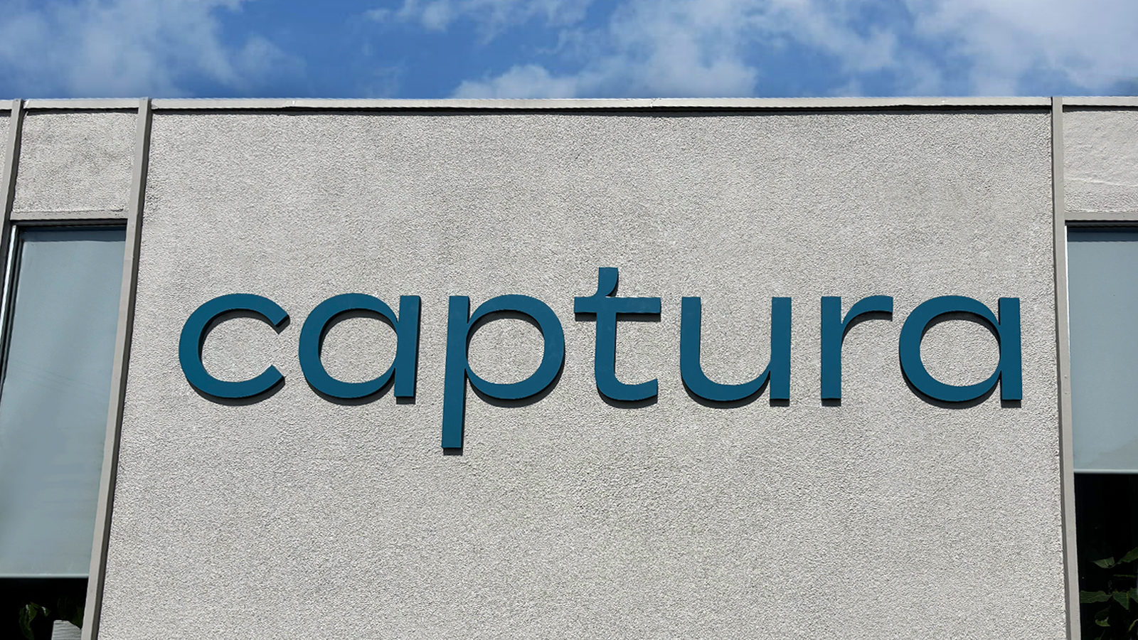 captura custom letter sign set up on the exterior wall