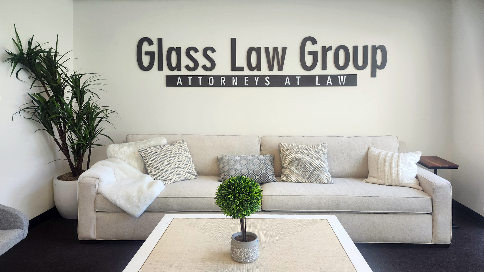 glass law group interior sign set up on the wall