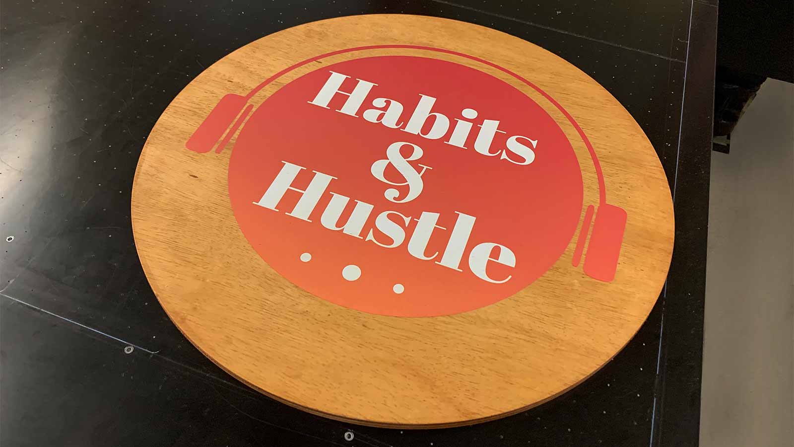 habits and hustle printed plywood sign