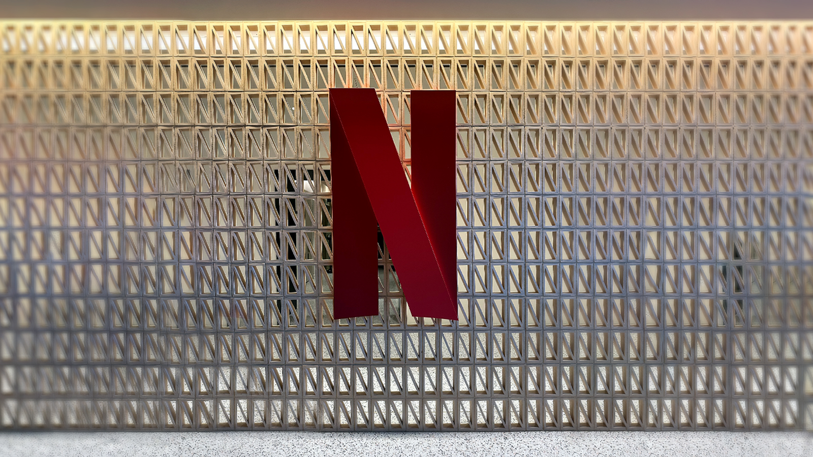 n-shaped red logo sign attached to a wall