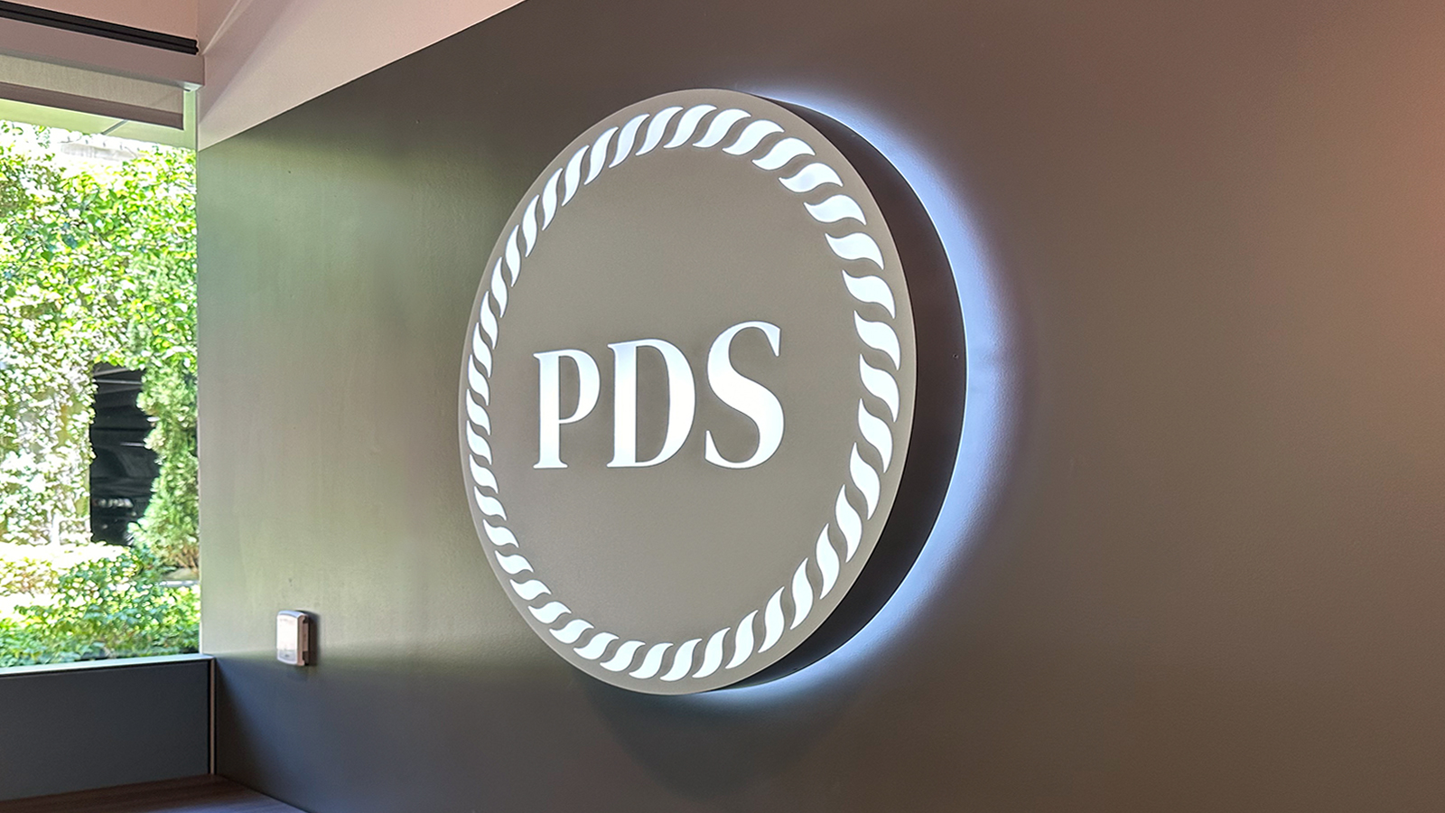 pds debt light box sign installed in the lobby