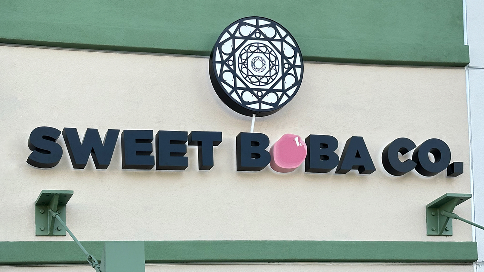 sweet boba co modern sign installed outdoors