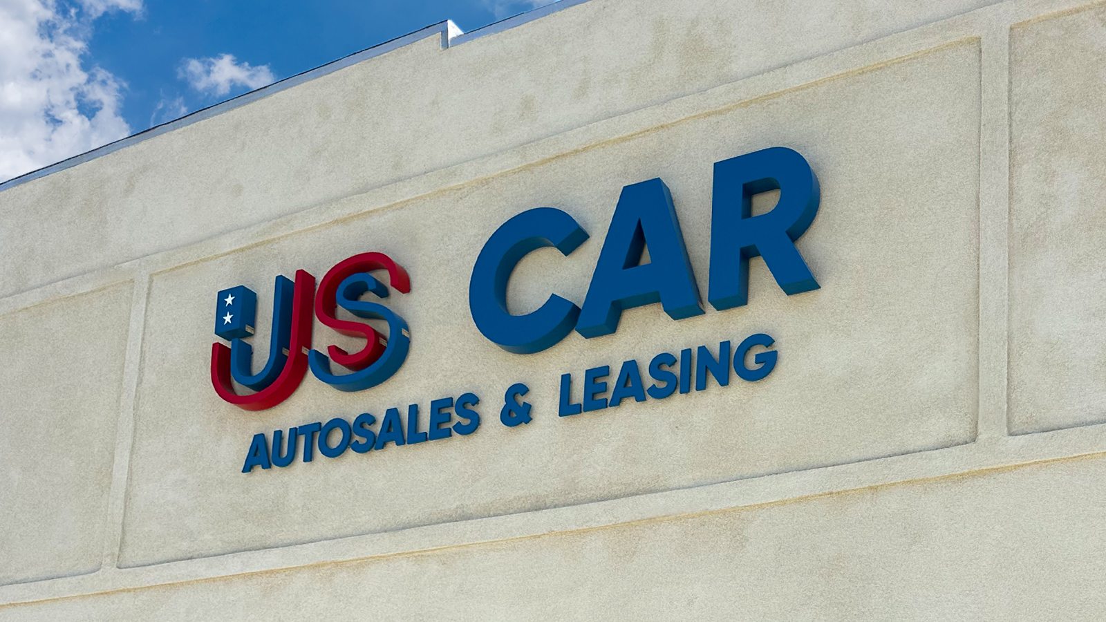 us car autosales and leasing 3d sign mounted on the facade