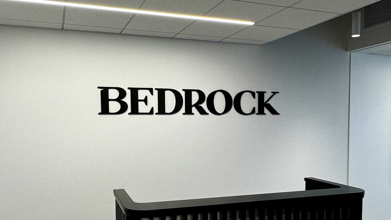 bedrock capital office sign installed at the reception