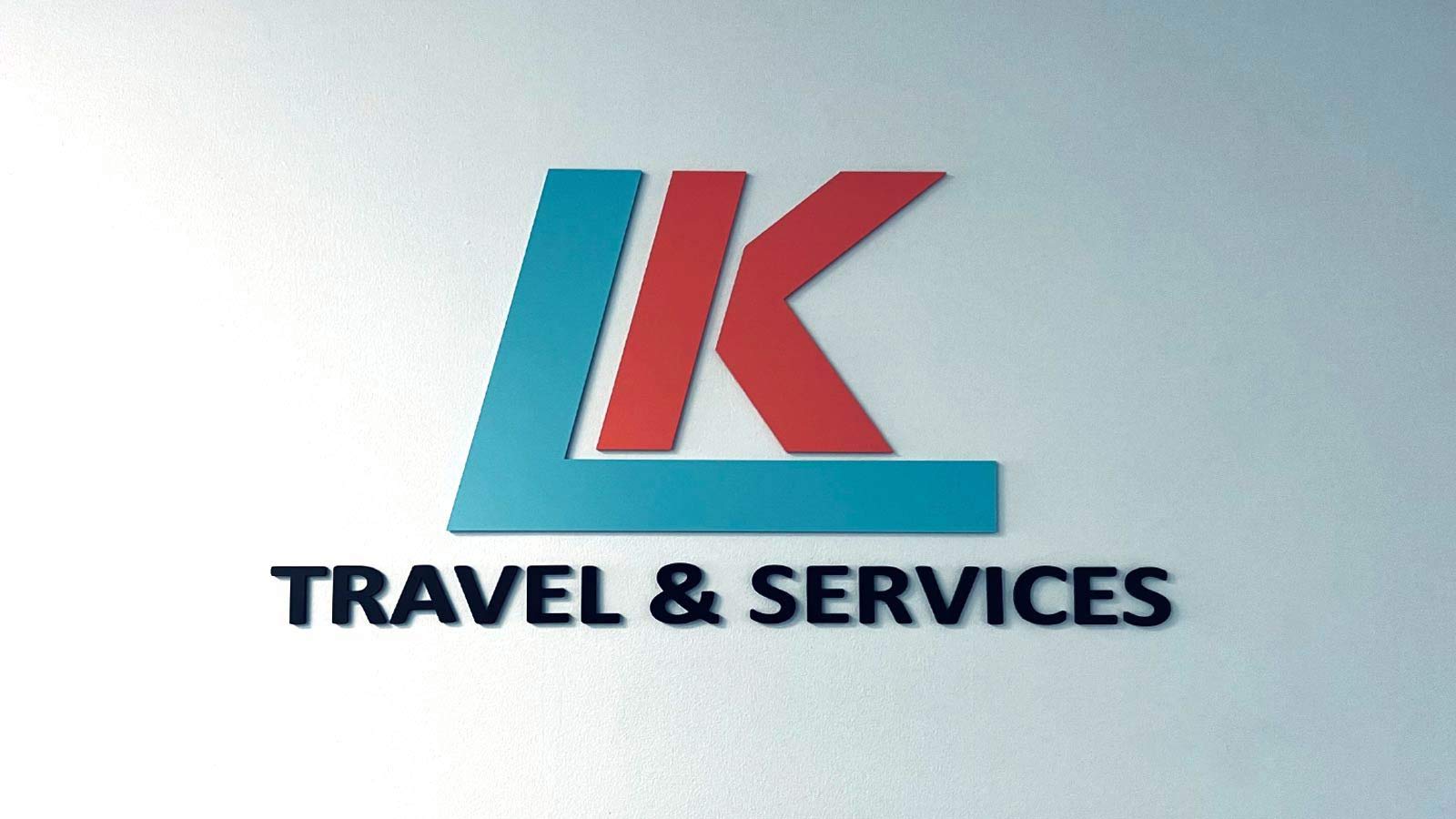 lk travel and services office sign