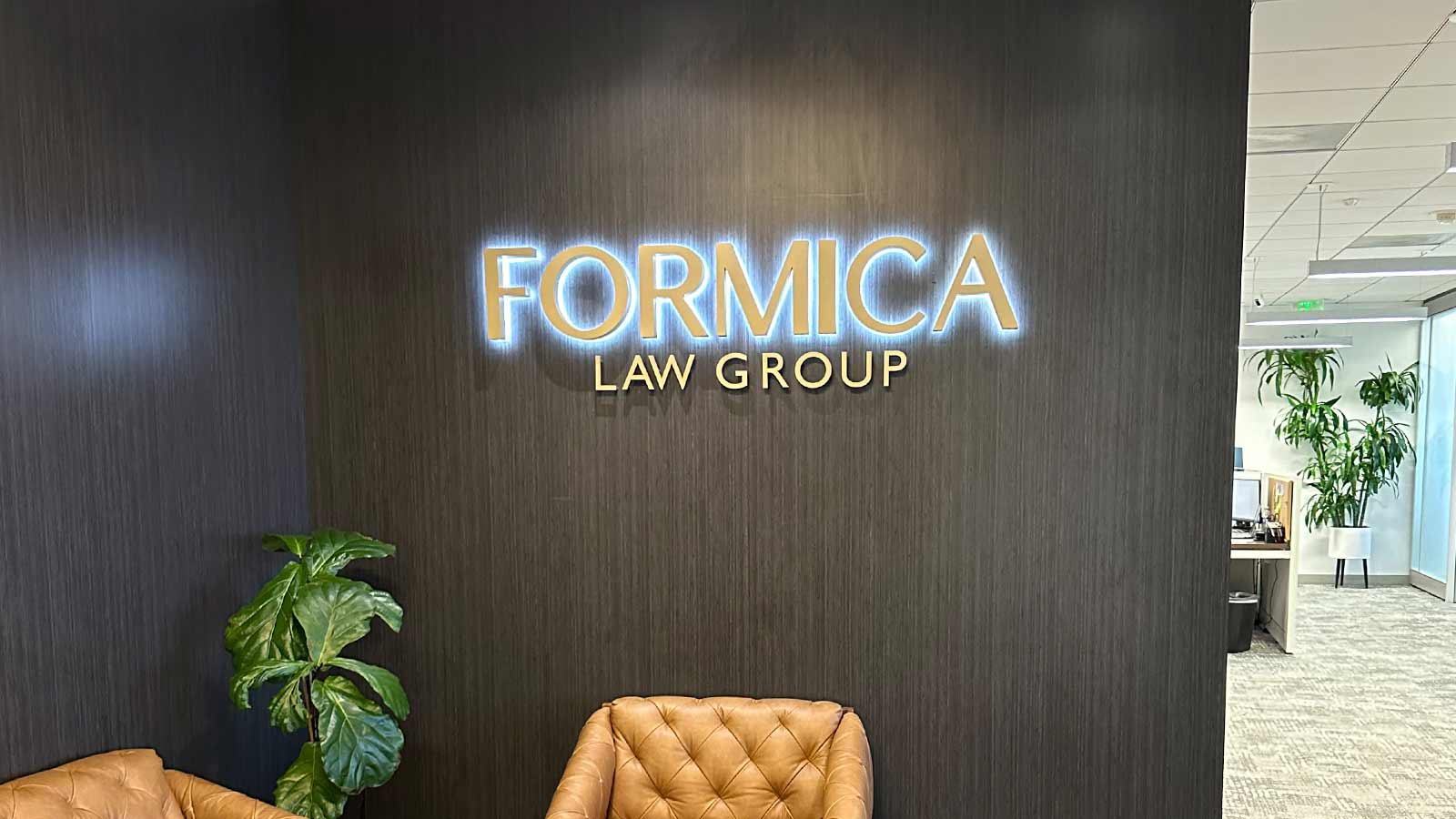 formica law group illuminated sign project on the wall