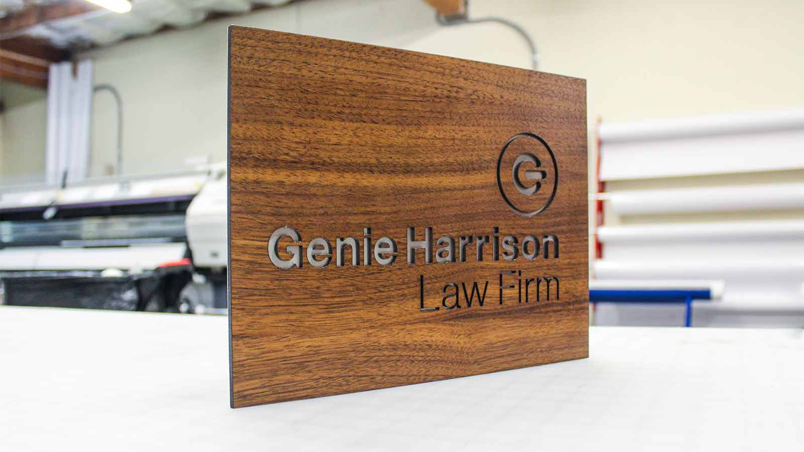 genie harrison law firm name sign