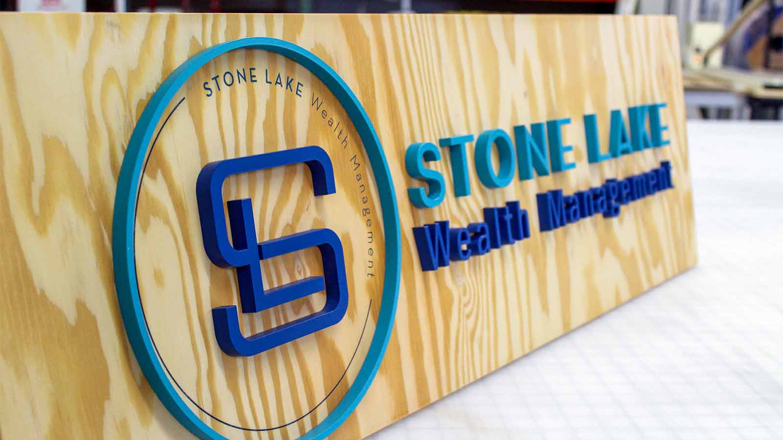 sl wealth management wooden acrylic sign