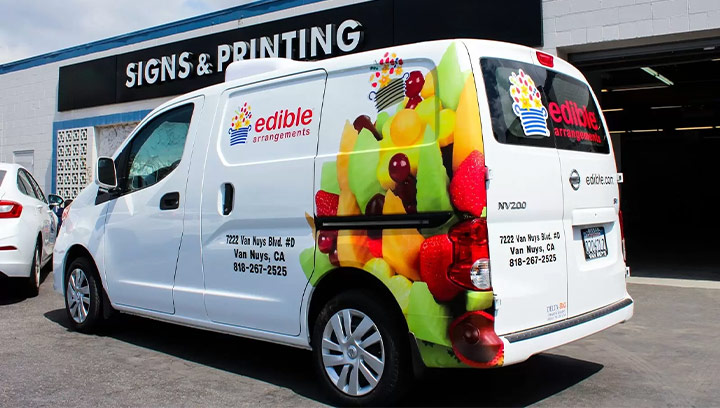 Vehicle branding for Edible Arrangements displaying the brand logo with contact information